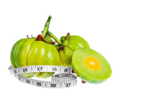 Garcinia Cambogia wrapped in measuring tape