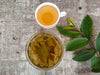 Guava leaf tea in a bowl and cup