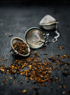 Loose tea leaves in a strainer